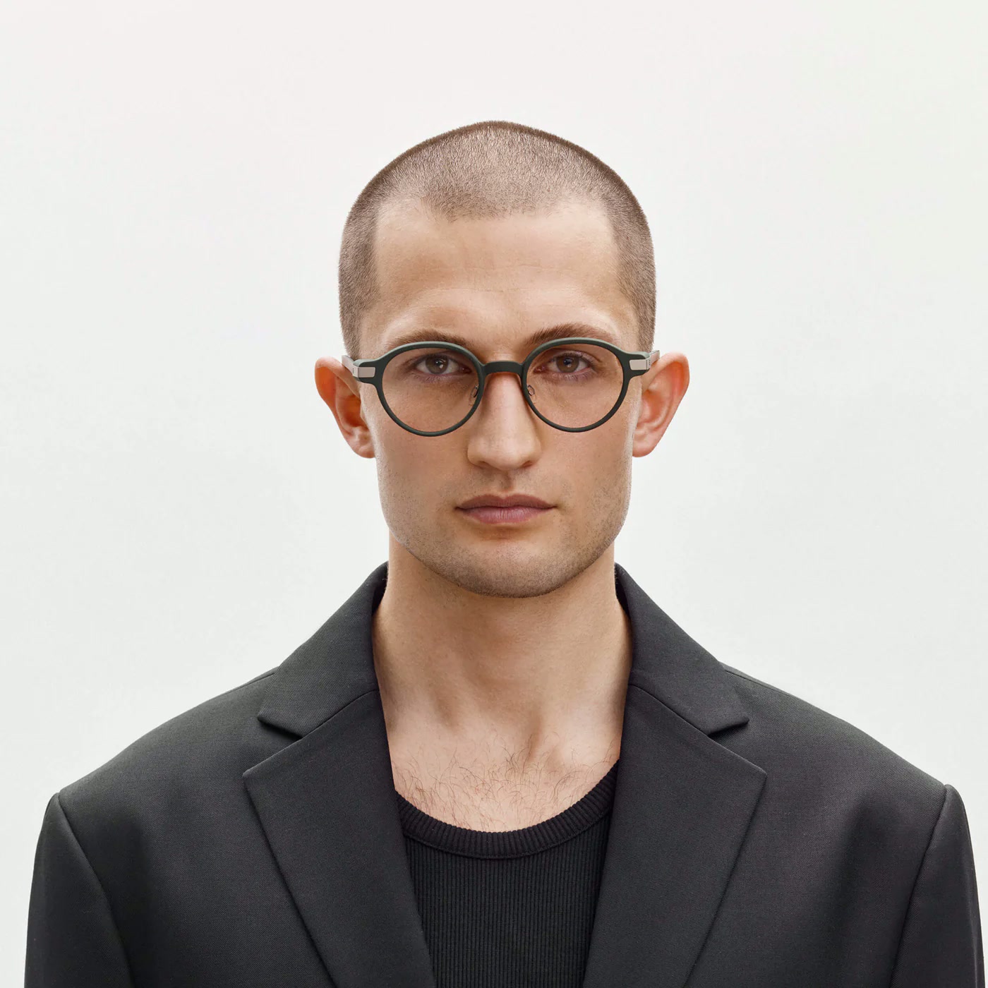 Person wearing green Even Realities G1 smart glasses