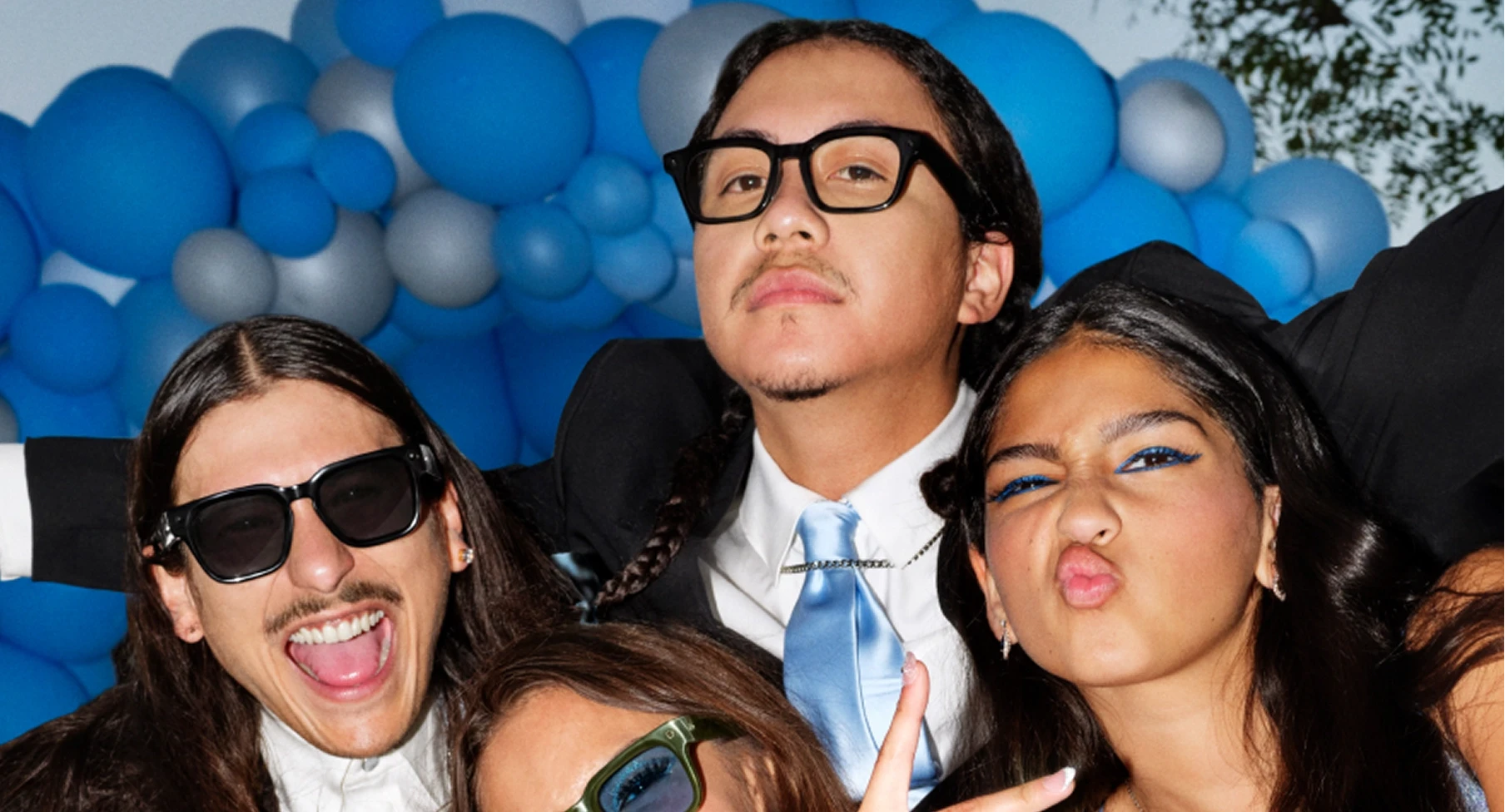 Person wearing black Meta Adventurer AI glasses at an event