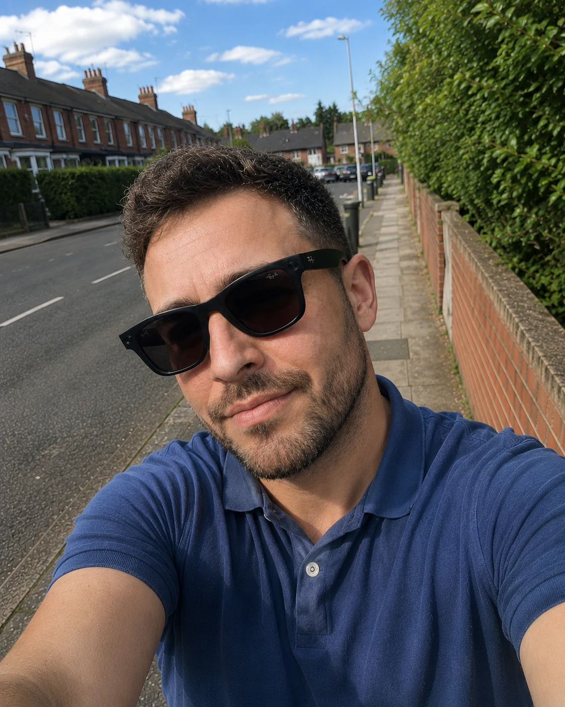 Wearing Ray-Ban Meta Gen 2 Wayfarer glasses outdoors in a blue shirt