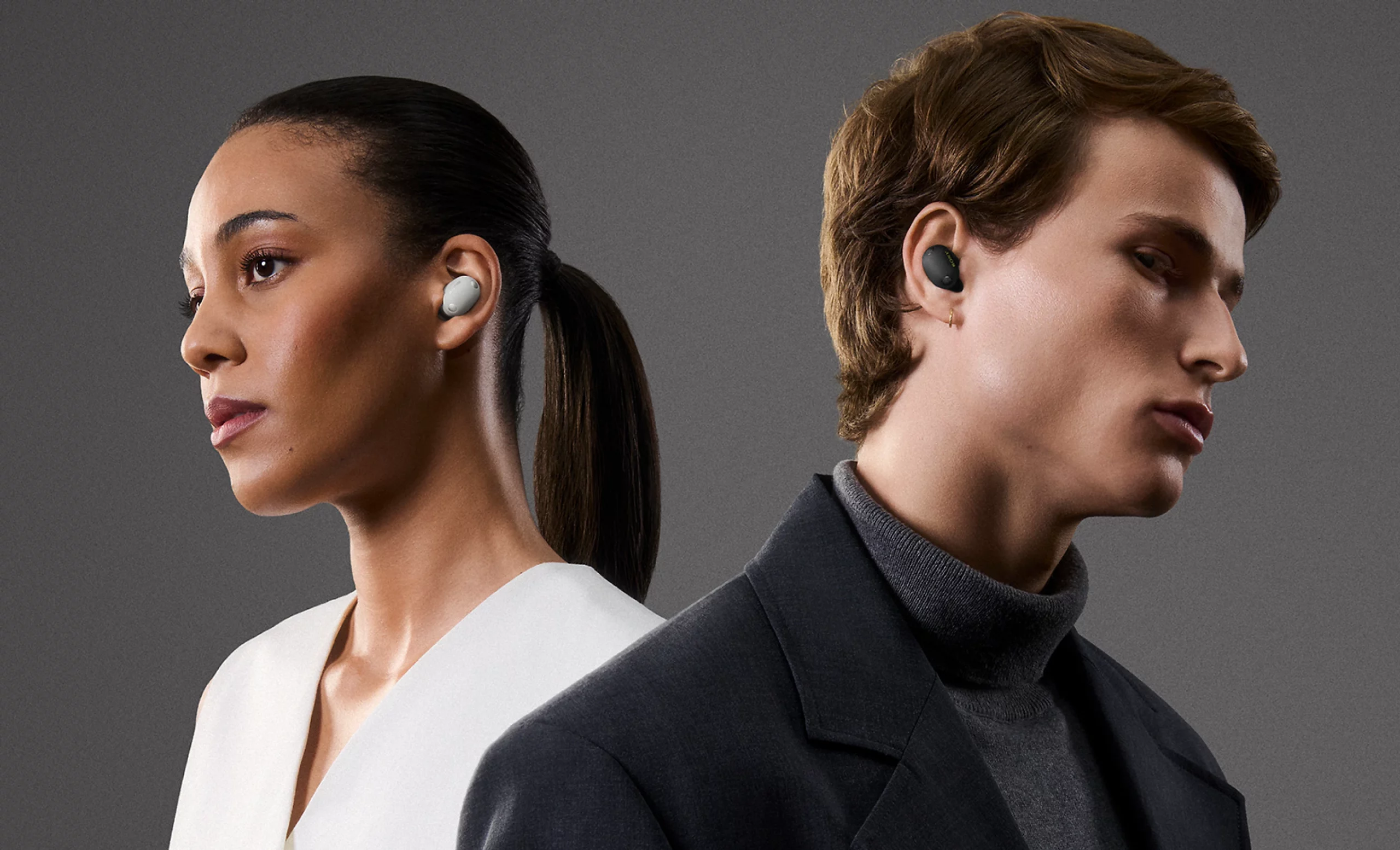 Two people wearing Sony WF-1000XM6 earbuds in Platinum Silver and black